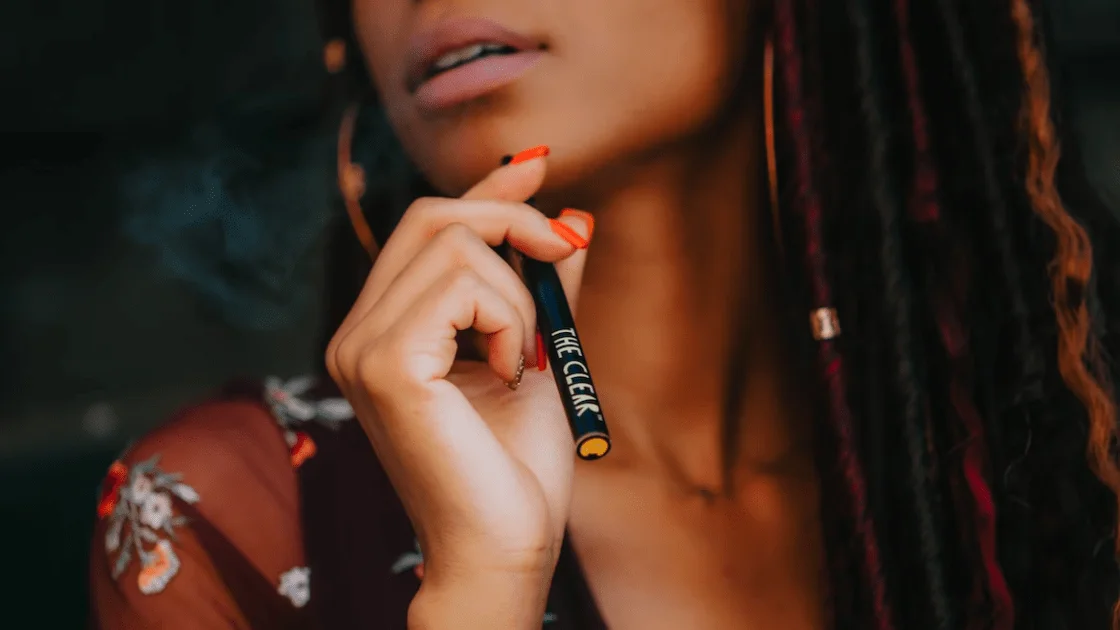 Woman smoking a dab pen vape that she bought from a weed dispensary in Port Credit, Mississauga. dispensary near me. weed store. cannabis dispensary. burlington cannabis. Port credit dispensary.