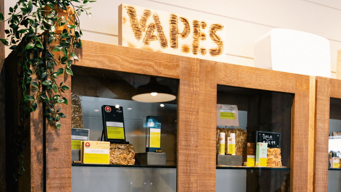 Variety of vaporizers and cannabis strains on display, perfect for beginners to explore. Visit The Farmhouse Cannabis Dispensary for more.