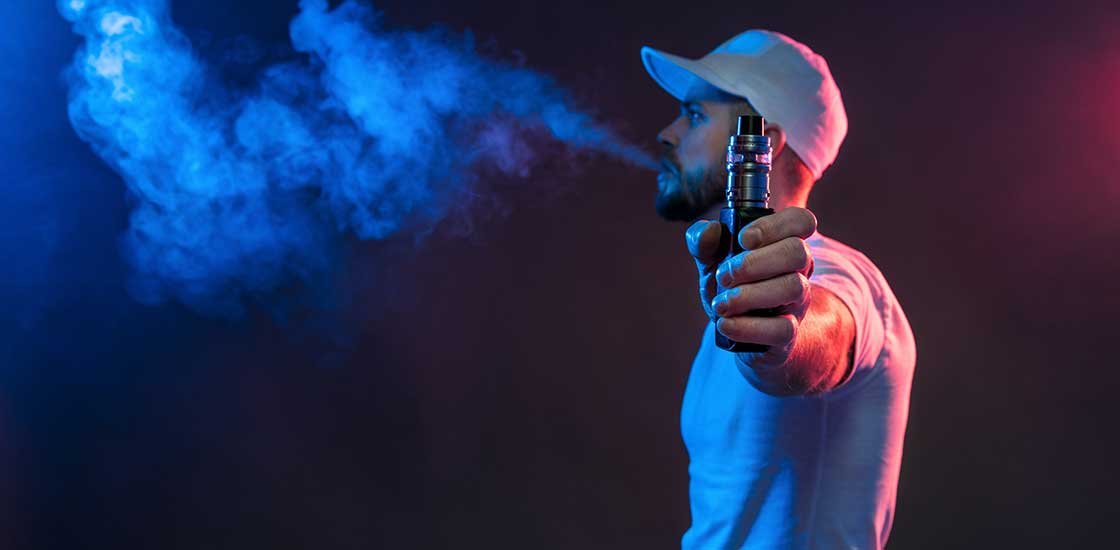 burlington man using a vape cartridge blowing clouds