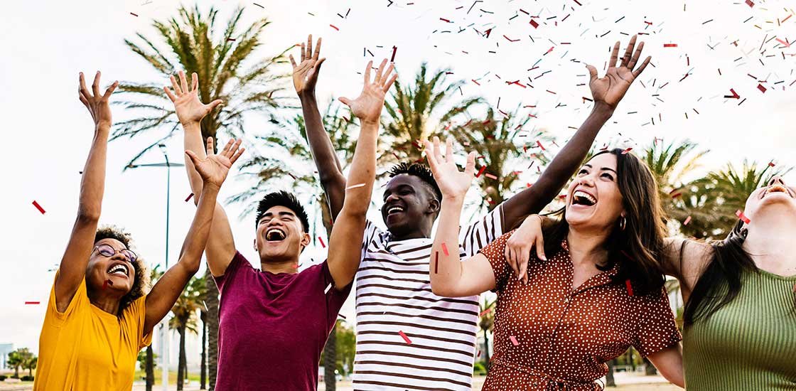 diverse happy young friends having fun together near a cannabis store in Mississauga.