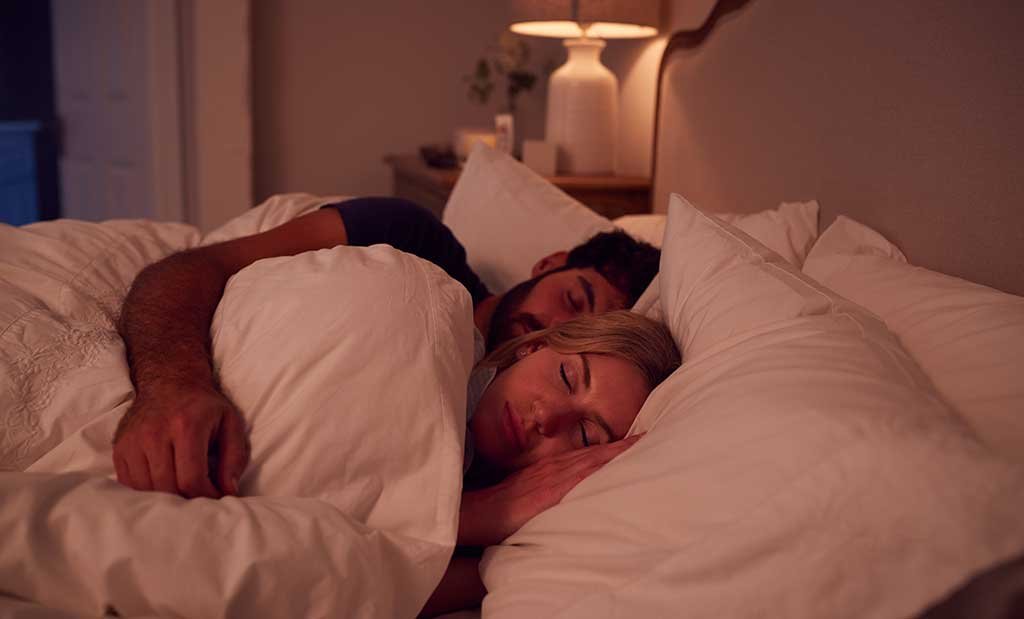 night-shot-of-peaceful-couple-asleep-in-bed